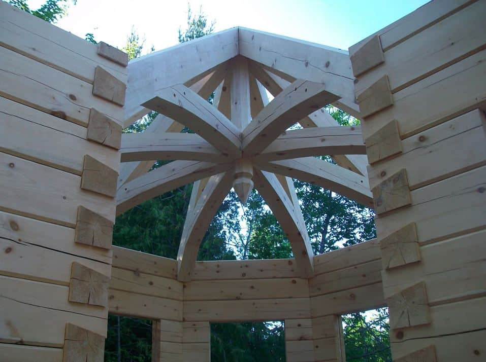 A timber turret is eased into place on Andy Kinsman's own Confederation Log & Timber Frame home