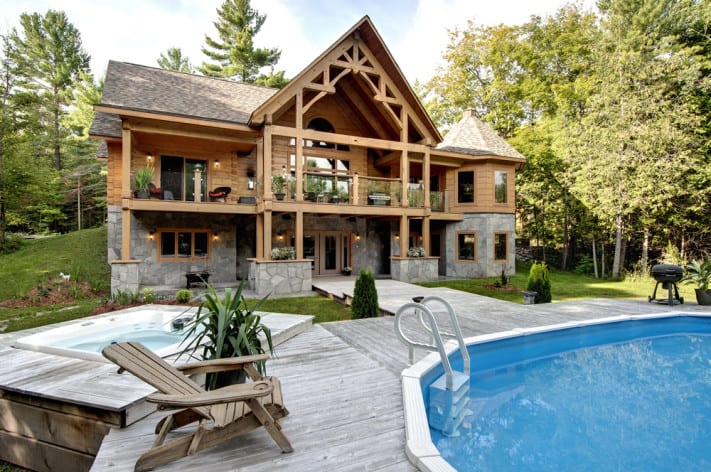 Andy Kinsman's Confederation. Log and timber frame bungalow with stone walkout basement