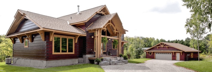 Rich KInsmans from Confederation Log & Timber Frame chose a two-tone burgundy and natural wood stain for his home.