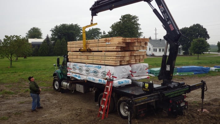 Exciting day - log home kits arrive! Here a Confederation Log & Timber Frame truck Delivers a Confederation Log Home